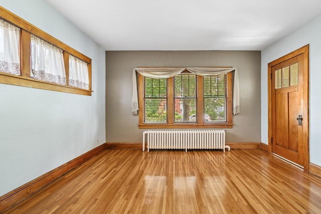 228 Sidney St W, Saint Paul, MN 55107 - spare room with radiator and light wood-style flooring