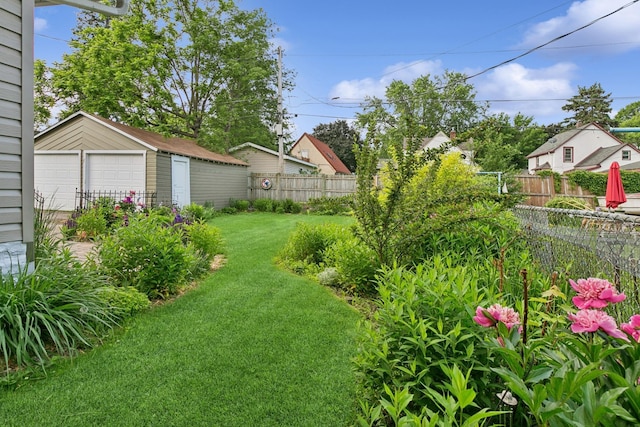228 Sidney St W, Saint Paul, MN 55107 - view of yard featuring a garage and an outbuilding