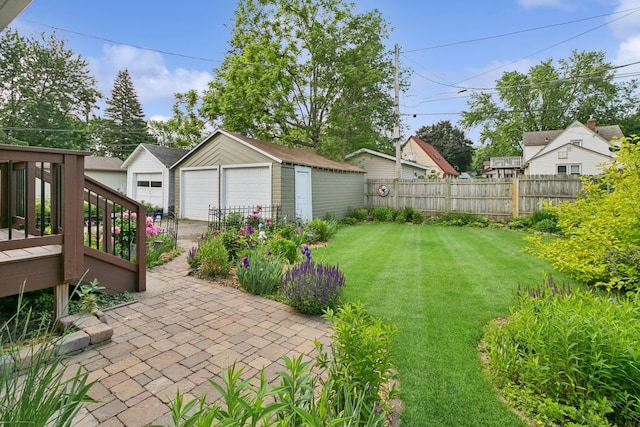 228 Sidney St W, Saint Paul, MN 55107 - view of yard featuring an outbuilding, a detached garage, and a wooden deck