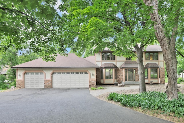 6033 Sargent Ct N, Lino Lakes, MN 55110 - view of front of property with driveway, a garage, and brick siding