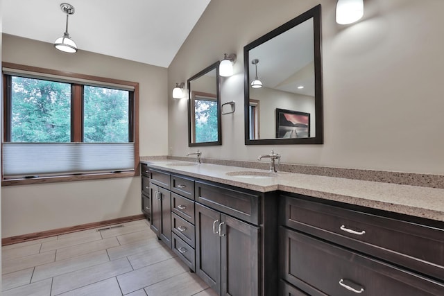 6033 Sargent Ct N, Lino Lakes, MN 55110 - bathroom featuring double vanity and vaulted ceiling