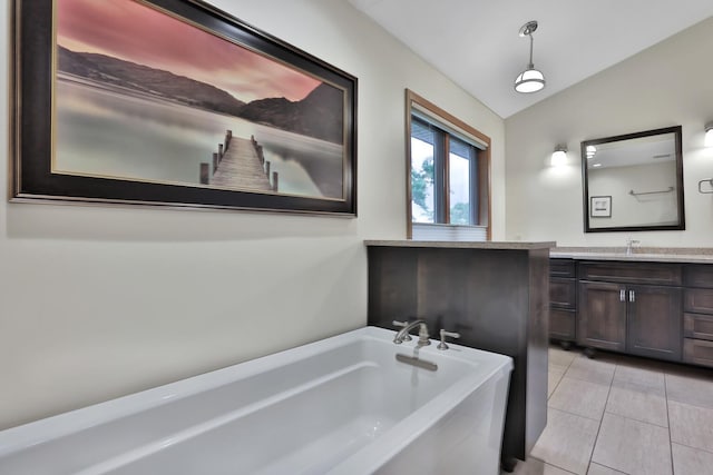 6033 Sargent Ct N, Lino Lakes, MN 55110 - bathroom with a garden tub, vanity, tile patterned floors, and lofted ceiling
