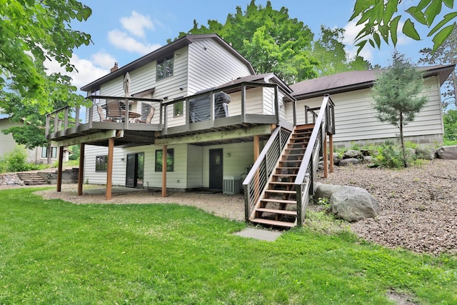 6033 Sargent Ct N, Lino Lakes, MN 55110 - back of house with a wooden deck, a lawn, and stairs