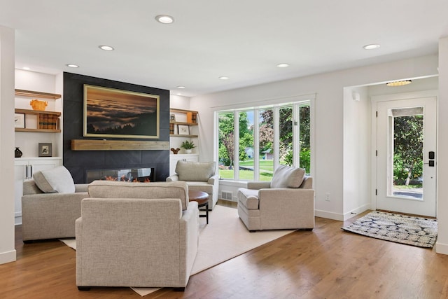 3930 Cottage Ln, Minnetonka, MN 55305 - living room with wood finished floors, recessed lighting, and a large fireplace