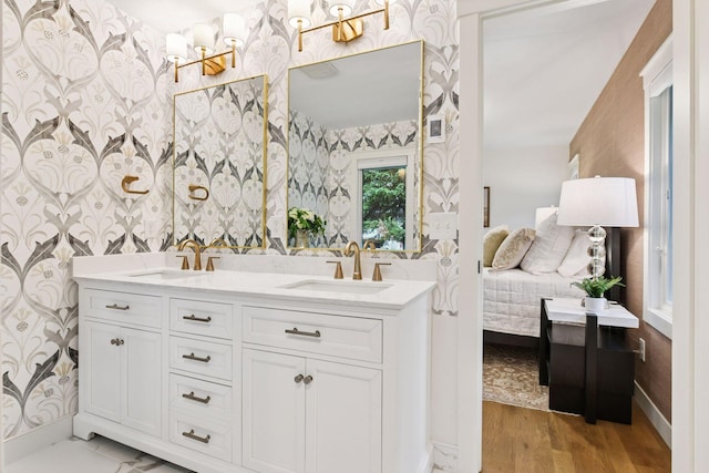 3930 Cottage Ln, Minnetonka, MN 55305 - full bath with wallpapered walls, double vanity, and wood finished floors