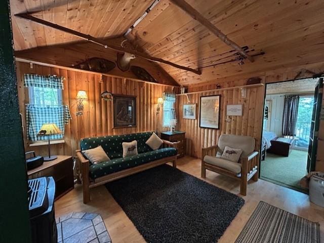 N11464 Fremont Ave, Chicog Twp, WI 54888 - living area featuring wood ceiling, wood walls, plenty of natural light, and wood finished floors