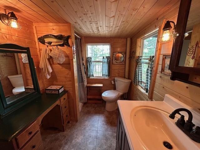 N11464 Fremont Ave, Chicog Twp, WI 54888 - bathroom featuring toilet, wooden walls, wood ceiling, plenty of natural light, and curtained shower