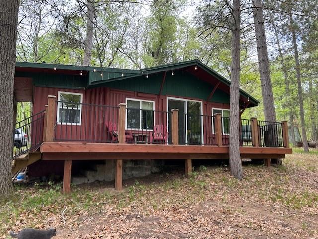 N11464 Fremont Ave, Chicog Twp, WI 54888 - back of house with a deck