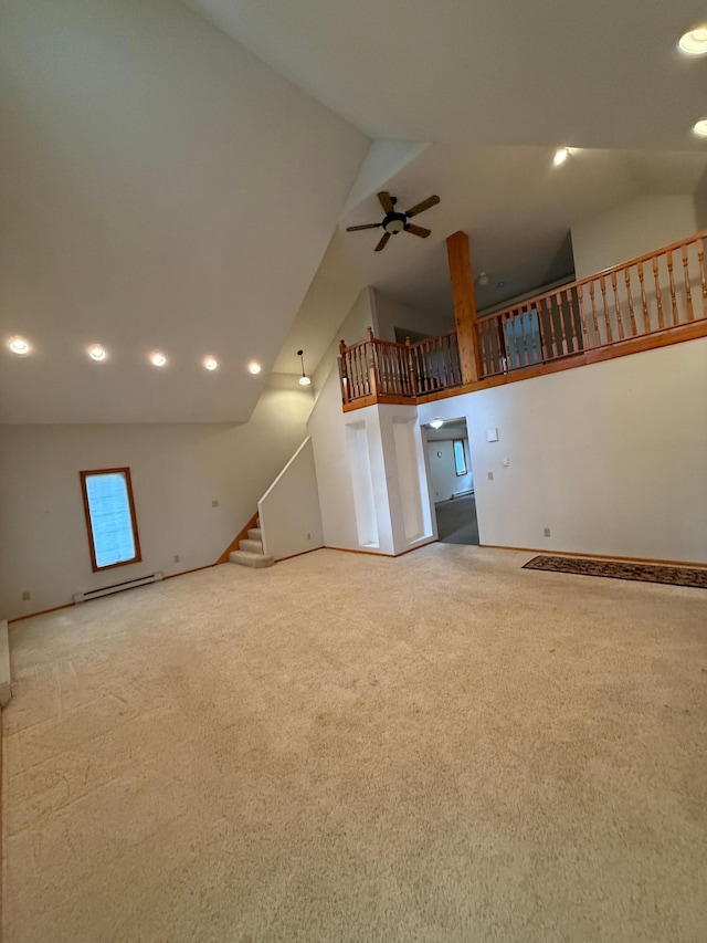 306 1st St, Belview, MN 56214 - unfurnished living room featuring vaulted ceiling, carpet, stairway, recessed lighting, and a baseboard heating unit