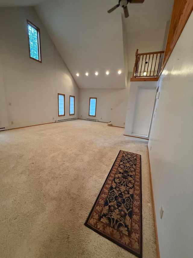 306 1st St, Belview, MN 56214 - unfurnished living room with high vaulted ceiling, carpet flooring, ceiling fan, and recessed lighting