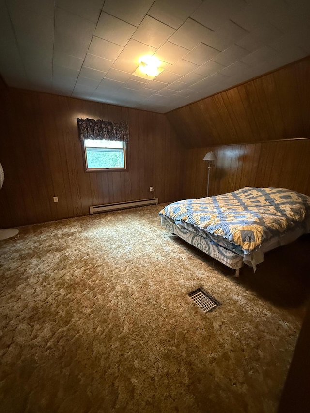 306 1st St, Belview, MN 56214 - carpeted bedroom with baseboard heating, wood walls, and vaulted ceiling
