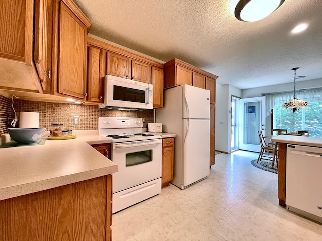 727 Cloud St NW, Bemidji, MN 56601 - kitchen featuring white appliances, light flooring, brown cabinetry, a textured ceiling, and tasteful backsplash