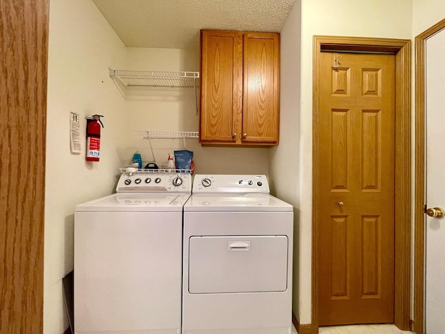 727 Cloud St NW, Bemidji, MN 56601 - laundry area featuring cabinet space and washer and dryer