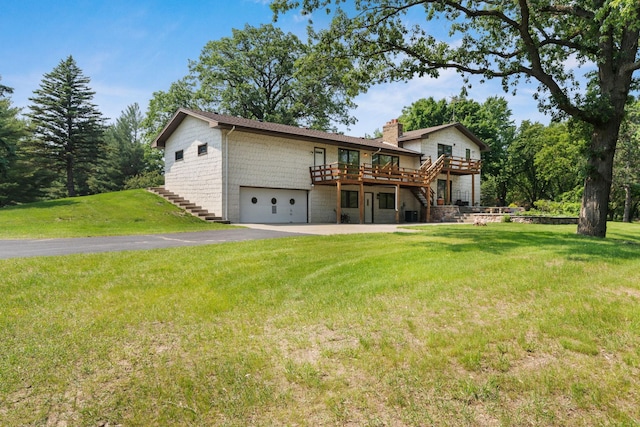 17855 Round Lake Blvd NW, Andover, MN 55304 - rear view of property featuring stairs, a wooden deck, a chimney, and an attached garage