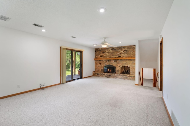 17855 Round Lake Blvd NW, Andover, MN 55304 - unfurnished living room with carpet flooring, a ceiling fan, a fireplace, and recessed lighting