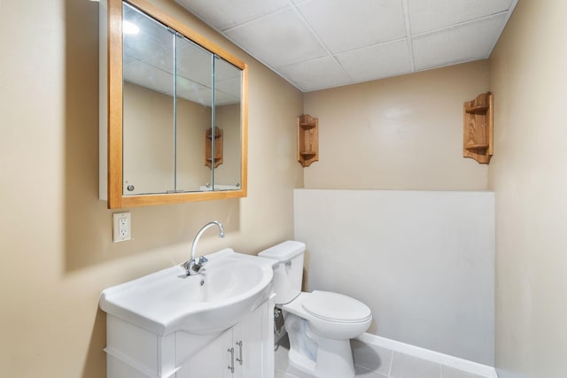 17855 Round Lake Blvd NW, Andover, MN 55304 - half bath featuring vanity, tile patterned floors, and a drop ceiling