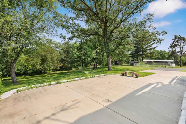 17855 Round Lake Blvd NW, Andover, MN 55304 - view of patio with view of scattered trees and an outbuilding