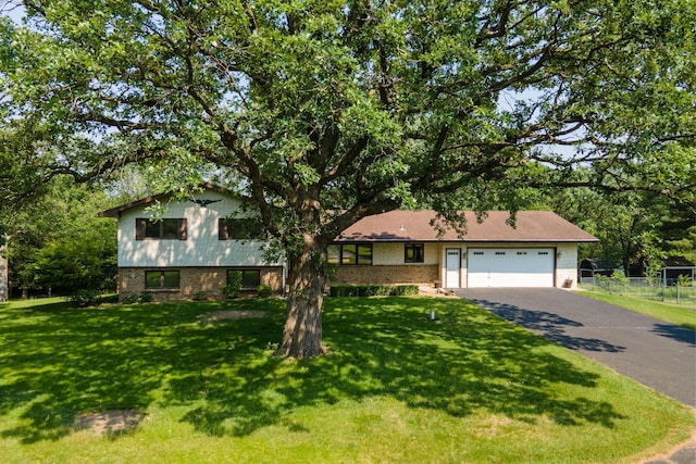 17855 Round Lake Blvd NW, Andover, MN 55304 - view of front facade with brick siding, asphalt driveway, and an attached garage