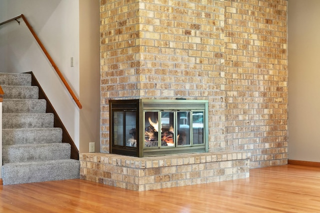 17855 Round Lake Blvd NW, Andover, MN 55304 - detailed view of wood finished floors and a fireplace