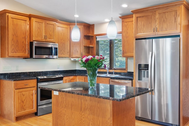 17855 Round Lake Blvd NW, Andover, MN 55304 - kitchen featuring appliances with stainless steel finishes, open shelves, light wood finished floors, a center island, and decorative light fixtures