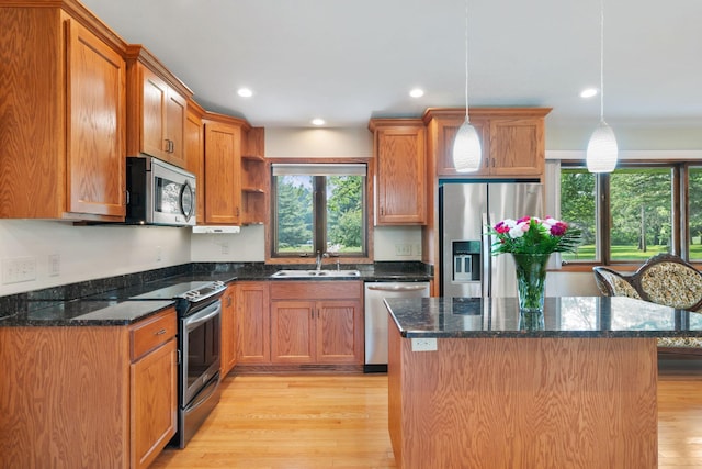 17855 Round Lake Blvd NW, Andover, MN 55304 - kitchen featuring appliances with stainless steel finishes, plenty of natural light, light wood-type flooring, open shelves, and recessed lighting