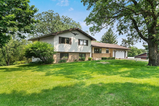 17855 Round Lake Blvd NW, Andover, MN 55304 - view of front facade with brick siding, an attached garage, a front lawn, and driveway