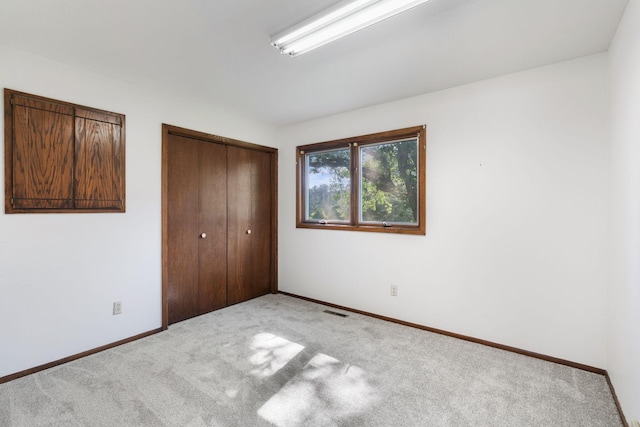 17855 Round Lake Blvd NW, Andover, MN 55304 - unfurnished bedroom featuring carpet and a closet