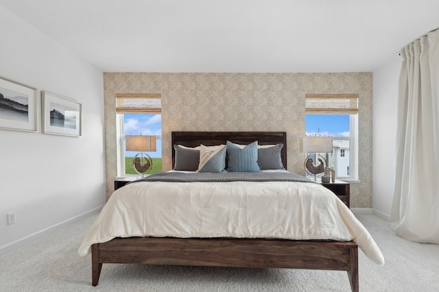 3908 Helmo Ave N, Oakdale, MN 55128 - carpeted bedroom featuring multiple windows and baseboards