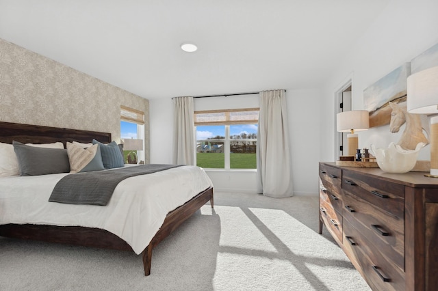 3908 Helmo Ave N, Oakdale, MN 55128 - bedroom with wallpapered walls and light carpet