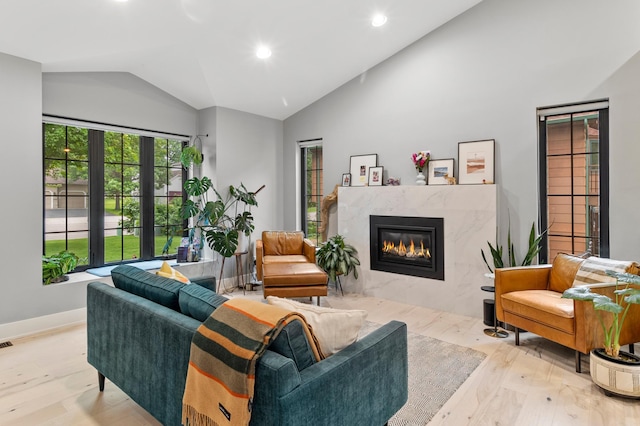 6855 Timber Crest Dr, Maple Grove, MN 55311 - living area featuring vaulted ceiling, a fireplace, wood finished floors, and recessed lighting