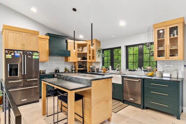 6855 Timber Crest Dr, Maple Grove, MN 55311 - kitchen featuring stainless steel appliances, backsplash, glass insert cabinets, a kitchen bar, and ventilation hood