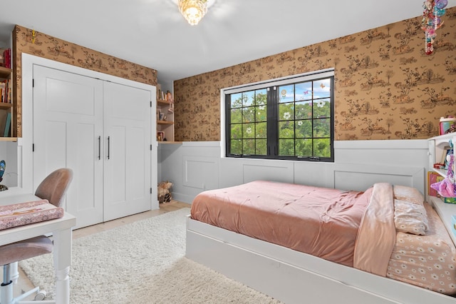 6855 Timber Crest Dr, Maple Grove, MN 55311 - bedroom with wallpapered walls, a wainscoted wall, and a closet