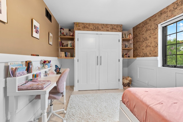 6855 Timber Crest Dr, Maple Grove, MN 55311 - bedroom with wallpapered walls, a wainscoted wall, and a closet