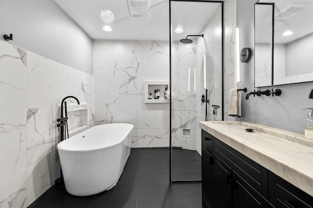 6855 Timber Crest Dr, Maple Grove, MN 55311 - bathroom with vanity, a freestanding tub, a marble finish shower, tile walls, and recessed lighting