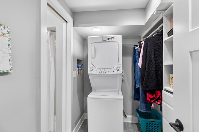 6855 Timber Crest Dr, Maple Grove, MN 55311 - laundry room featuring estacked washer and dryer and tile patterned floors