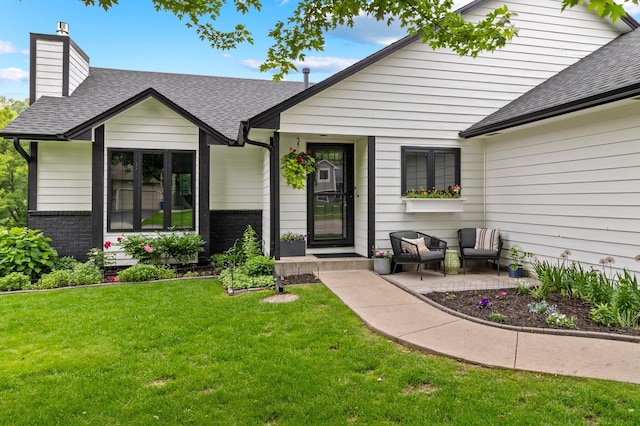 6855 Timber Crest Dr, Maple Grove, MN 55311 - view of front of home featuring a chimney, roof with shingles, a front yard, and brick siding