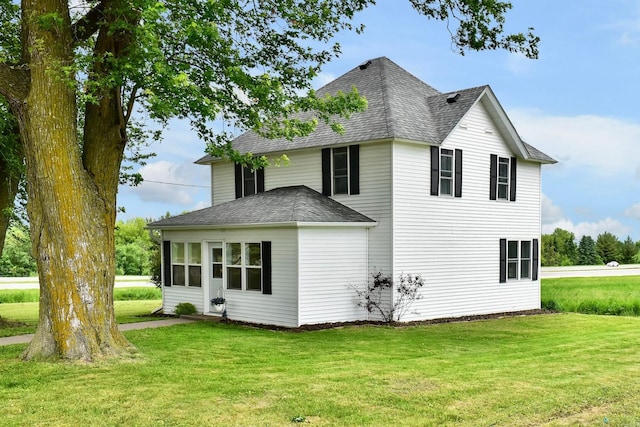 29827 Elfmanns Dr, Wilson Twp, MN 55987 - rear view of house with a shingled roof and a yard