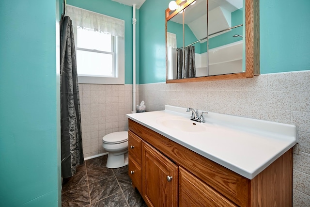 29827 Elfmanns Dr, Wilson Twp, MN 55987 - bathroom with tile walls, vanity, toilet, a shower with shower curtain, and wainscoting