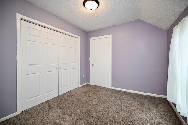29827 Elfmanns Dr, Wilson Twp, MN 55987 - unfurnished bedroom featuring a textured ceiling, carpet flooring, a closet, and vaulted ceiling