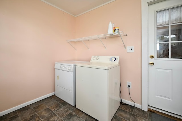 29827 Elfmanns Dr, Wilson Twp, MN 55987 - washroom with baseboards, washing machine and clothes dryer, stone finish floors, and crown molding