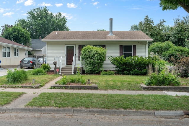 2022 Nokomis Ave, Saint Paul, MN 55119 - view of front of property with a front lawn and a shingled roof