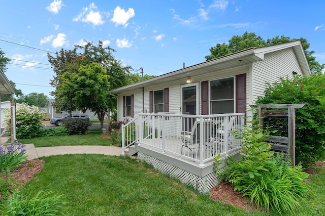 2022 Nokomis Ave, Saint Paul, MN 55119 - view of front of house with a front lawn and a deck