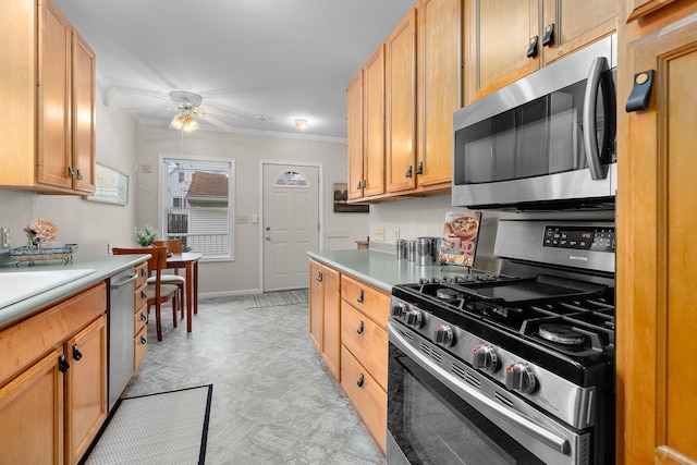 2022 Nokomis Ave, Saint Paul, MN 55119 - kitchen with stainless steel appliances, crown molding, ceiling fan, and light countertops