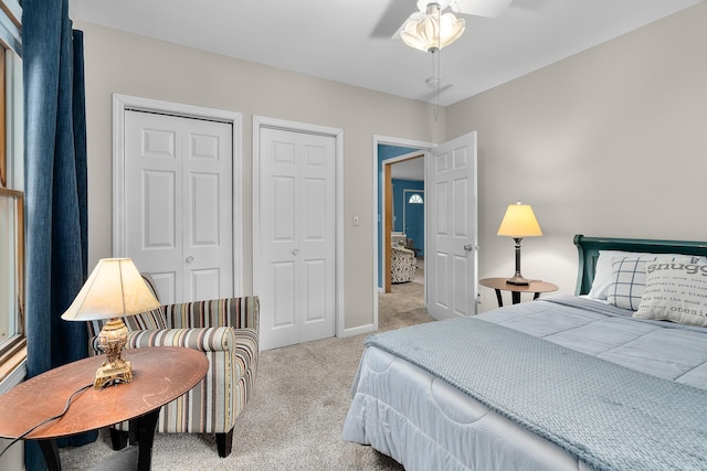 2022 Nokomis Ave, Saint Paul, MN 55119 - bedroom featuring multiple closets, carpet flooring, and a ceiling fan