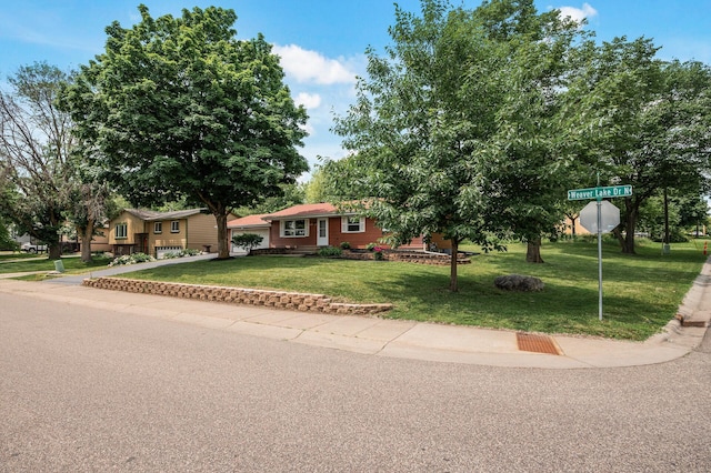 17900 Weaver Lake Dr, Maple Grove, MN 55311 - view of front facade with a front lawn and concrete driveway