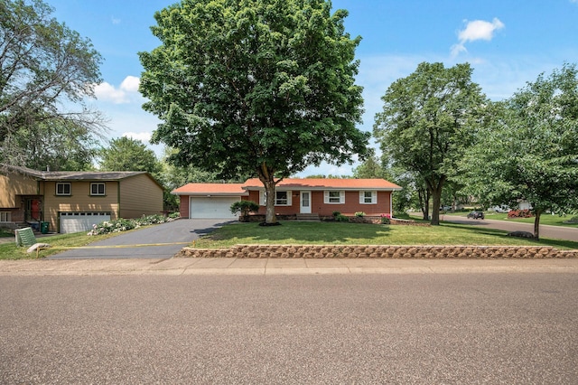 17900 Weaver Lake Dr, Maple Grove, MN 55311 - view of front facade with asphalt driveway and a front yard