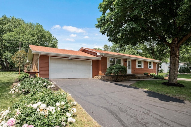 17900 Weaver Lake Dr, Maple Grove, MN 55311 - ranch-style house with asphalt driveway, a garage, and a front lawn