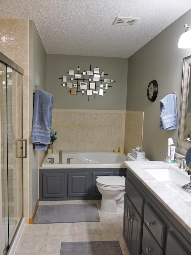 17098 Pheasant Meadow Ln SW, Prior Lake, MN 55372 - bathroom featuring a garden tub, vanity, a textured ceiling, tile patterned flooring, and a shower stall