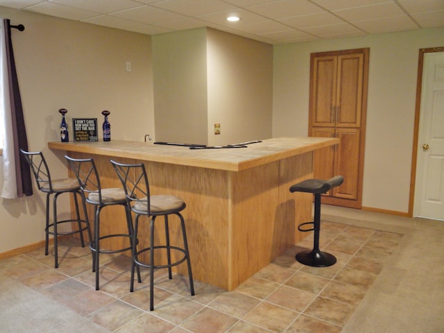 17098 Pheasant Meadow Ln SW, Prior Lake, MN 55372 - indoor dry bar with a paneled ceiling, recessed lighting, and light tile patterned flooring