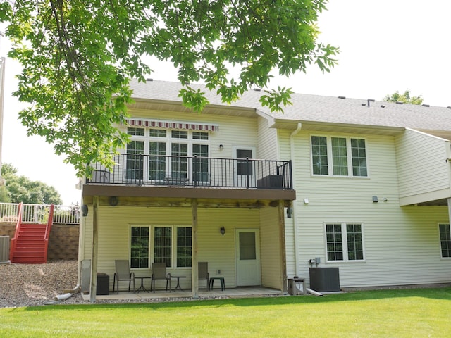 17098 Pheasant Meadow Ln SW, Prior Lake, MN 55372 - back of house featuring a patio, a lawn, stairway, and roof with shingles
